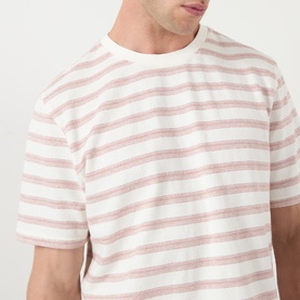 Model wearing Wax London Dean Stitched Striped T-Shirt in ecru and rust, crew neck, short sleeves, textured striped cotton fabric.