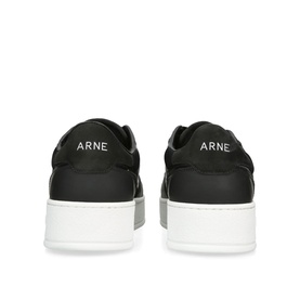 Arne black leather low-top trainers, rear view showing white branded heel tab and thick white flatform sole.