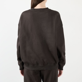 Model wearing Adanola AS Logo Oversized Sweatshirt in Coffee Bean, crew neck, dropped shoulders, shown from the back with matching trousers.