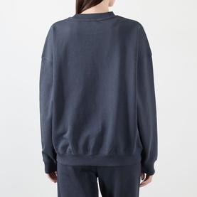 Model wearing Adanola Varsity Logo Oversized Sweatshirt in Midnight Blue, back view, crew neck, dropped shoulders, paired with matching trousers.