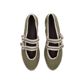 Flabelus green canvas flat shoes with cream trim and double buckle strap detail, overhead view