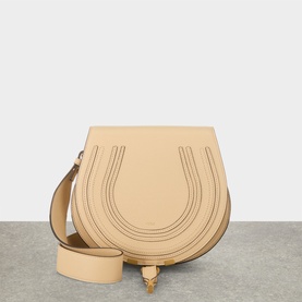 Chloe Marcie Saddle Crossbody Bag in Petal Beige grained calfskin with gold-toned hardware, loop fastening, and adjustable strap
