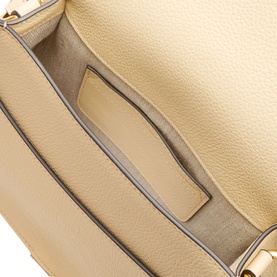 Chloe Marcie Saddle Crossbody Bag in Petal Beige, interior view showing slip pocket, linen-cotton lining and gold-toned hardware detail.