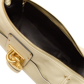 Chloe Cloudy Cream buffalo leather shoulder bag interior, showing black lining, zip closure and gold-tone turn-lock hardware detail.