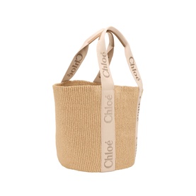 Chloe Tote in blushy beige woven paper with branded linen handles featuring Chloe logo lettering, bucket silhouette