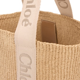 Chlo&eacute; Blushy Beige paper tote bag, close-up of woven texture with branded linen logo strap and tan interior lining