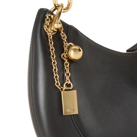 Chlo&eacute; black leather shoulder bag with gold-tone chain strap, ball charm and logo padlock detail, close-up view