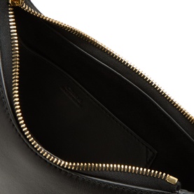 Chlo&eacute; black leather shoulder bag interior, showing gold-tone zip closure and smooth leather lining with internal pocket