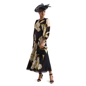 Model wearing Phase Eight black floral midi dress with long sleeves, styled with black strappy heels and a black fascinator hat