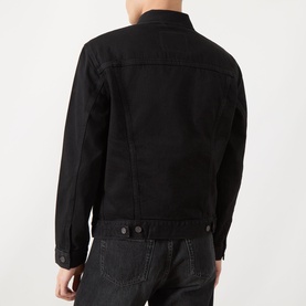 Model wearing Levi's black denim casual jacket, rear view, button-front fastening with adjustable hem tabs, paired with dark jeans