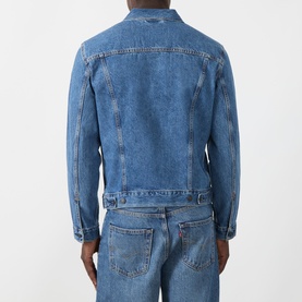 Model wearing Levi's washed blue denim casual jacket, rear view, styled with matching blue denim jeans