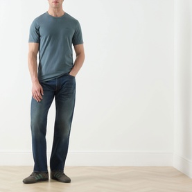 Model wearing Levis Original Logo T-Shirt in Dark Slate, crew neck, short sleeves, styled with dark wash jeans and grey shoes.