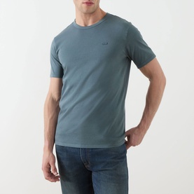 Model wearing Levis Original Logo T-Shirt in dark slate cotton, with crew neck, short sleeves, and small chest logo. Styled with blue jeans.