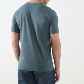 Model wearing Levis Original Logo T-Shirt in Dark Slate, rear view, crew neck, short sleeves, styled with blue jeans.