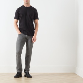 Model wearing Levi's Mineral Black crew neck cotton T-shirt with grey jeans and black leather shoes.