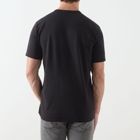 Model wearing Levi's Mineral Black crew neck T-shirt, 100% cotton, short sleeves, shown from the back, styled with grey jeans.