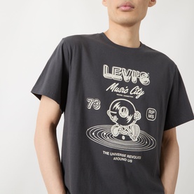 Model wearing Levi's Music City 2 Phantom crew neck T-shirt with graphic print featuring DJ character and retro vinyl disc design.