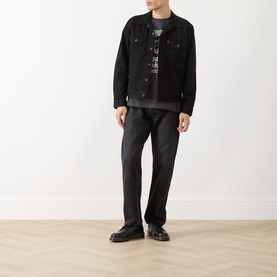 Model wearing Levi's Music City 2 Phantom crew neck T-shirt, styled with black denim jacket and dark jeans.