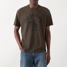 Model wearing Levi's Crew Neck T in coffee brown cotton jersey with dark graphic print, styled with light blue jeans.