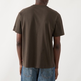 Model wearing Levis Crew Neck T in coffee brown cotton, rear view, styled with light blue jeans.