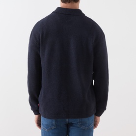 Model wearing Levi's Boulder Half-Zip Polo Sweater in Navy HTR Novelty Stitch, back view, styled with blue jeans