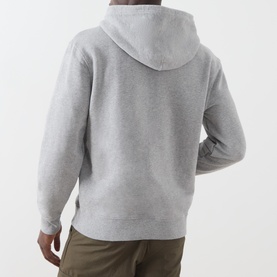 Model wearing Levi's hoodie in medium vintage heather grey, rear view, with khaki trousers. Relaxed fit, kangaroo pocket, drawstring hood.