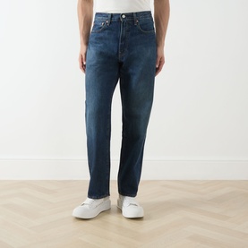 Model wearing Levi's 3049 Loose Jeans in Hard Rain dark blue wash, styled with white trainers.