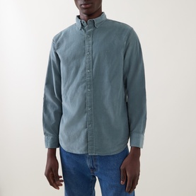 Model wearing Levi's Reg Shirt in Stormy Sea, a washed teal cotton corduroy with button-down collar, styled with blue jeans.