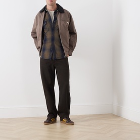 Model wearing Levi's Toby Vintage Indigo Reg Shirt in blue plaid cotton, styled with brown jacket and dark trousers