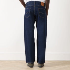 Model wearing Levi's 3049 Straight Jeans in Keep It Forever Rinse, dark indigo wash, shown from behind with contrast stitching detail