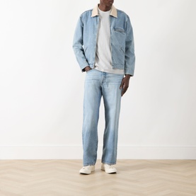Model wearing Levis 501&reg; Loose Jeans in In My Bronco light wash, styled with a light denim sherpa jacket and white trainers.