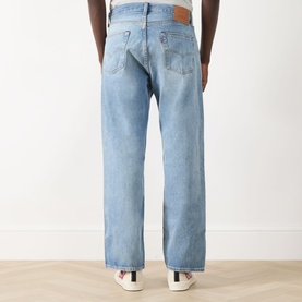 Model wearing Levi's 501&reg; Loose Jeans in IN MY BRONCO light wash, rear view showing logo patch, five-pocket styling and straight leg.
