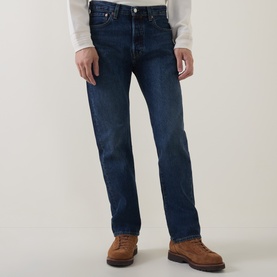 Model wearing Levi's 3049 Straight Jeans in Terra Linda dark blue wash, styled with a white top and tan leather boots.