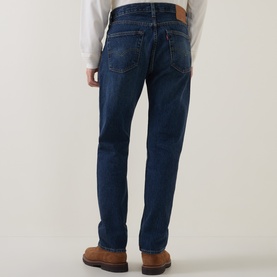Model wearing Levi's 3049 Straight Jeans in Terra Linda dark blue wash, paired with a white top and brown leather shoes.