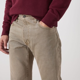 Model wearing Levi's 3049 straight jeans in Salty Capers GD, styled with a burgundy sweatshirt. Close-up of waist and thigh area.