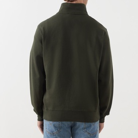 Model wearing Levis Original Housemark Logo Half-Zip Sweater in dark green, shown from back, styled with light blue jeans.