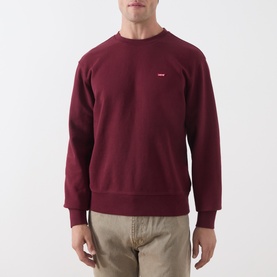 Model wearing Levi's tawny port cotton crew neck sweatshirt with small logo, styled with beige chinos