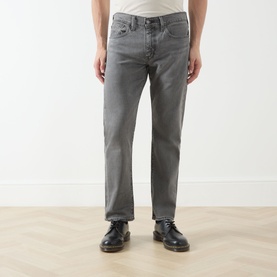 Model wearing Levis 3049 Tapered Jeans in Granite Shadow grey denim, styled with black leather lace-up shoes.