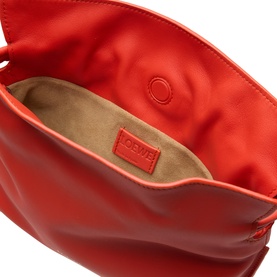 Loewe Sunrise Orange calfskin clutch, open view showing tan suede lining and embossed logo patch interior