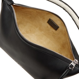 Loewe Cala Top Handle Pouch Bag in black lambskin, open view showing tan leather lining, silver-tone zip hardware and branded interior label.
