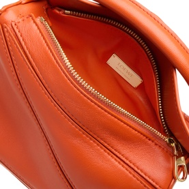 Loewe Deep Saffron nappa lambskin top handle bag, open interior view showing orange lining and gold-tone zip