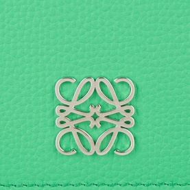 Loewe wallet in Clover Green pebbled calfskin, close-up of silver Anagram logo hardware detail