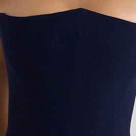 House of CB navy strapless structured bodice detail, showing seamed corset-style construction in stretch fabric