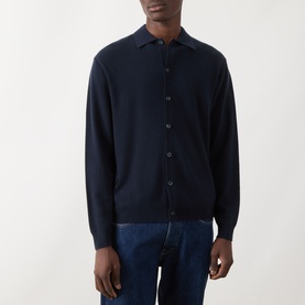 Model wearing Seven Jeans Cashmere Knitted Polo Shirt in Midnight, styled with blue denim jeans