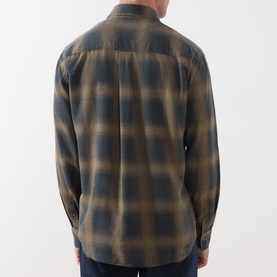Model wearing Seven Jeans Reg Shirt in Cottage, olive and navy ombre plaid check, long sleeves, back view