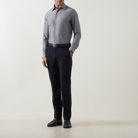 Model wearing Boggi Milano light blue casual shirt in cotton blend, styled with dark navy trousers and black leather shoes