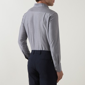 Model wearing Boggi Milano light blue fine stripe casual shirt, rear view, paired with navy trousers
