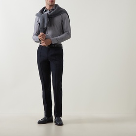 Model wearing Boggi Milano light blue casual shirt, styled with grey scarf, navy trousers and dark leather shoes