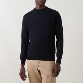 Model wearing Boggi Milano navy blue wool crew neck jumper, styled with beige trousers