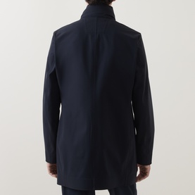 Model wearing Boggi Milano Longline Car Coat in navy blue, rear view showing stand collar, concealed zip placket and straight hem.